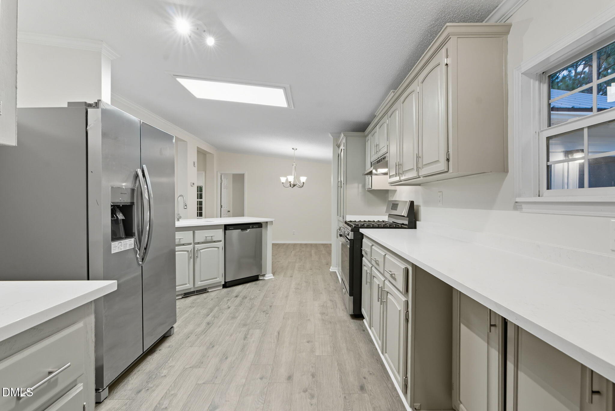 147 Ridge View Drive Cameron, NC 28326 - Photo 11 of 41 a kitchen with white cabinets and stainless steel appliances