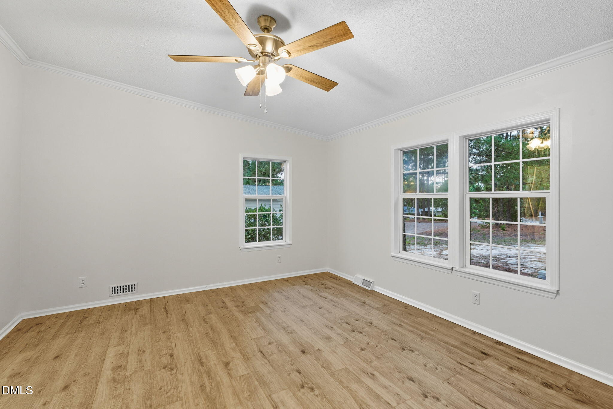 147 Ridge View Drive Cameron, NC 28326 - Photo 17 of 41 an empty room with wooden floor and windows