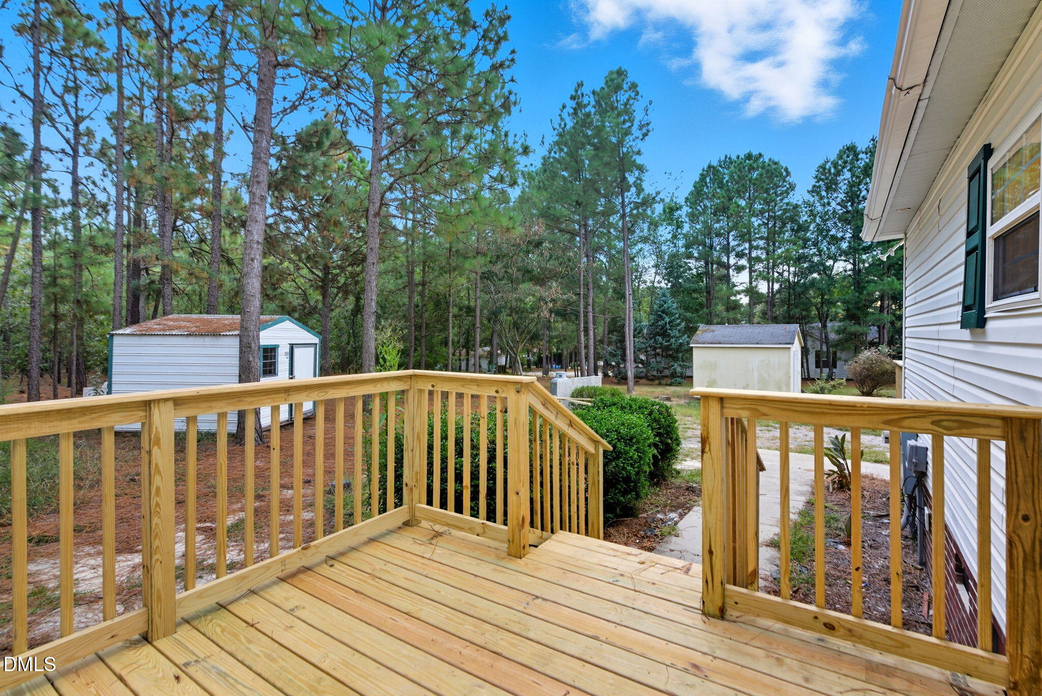 147 Ridge View Drive Cameron, NC 28326 - Photo 27 of 41 a view of wooden deck and a yard with swimming pool