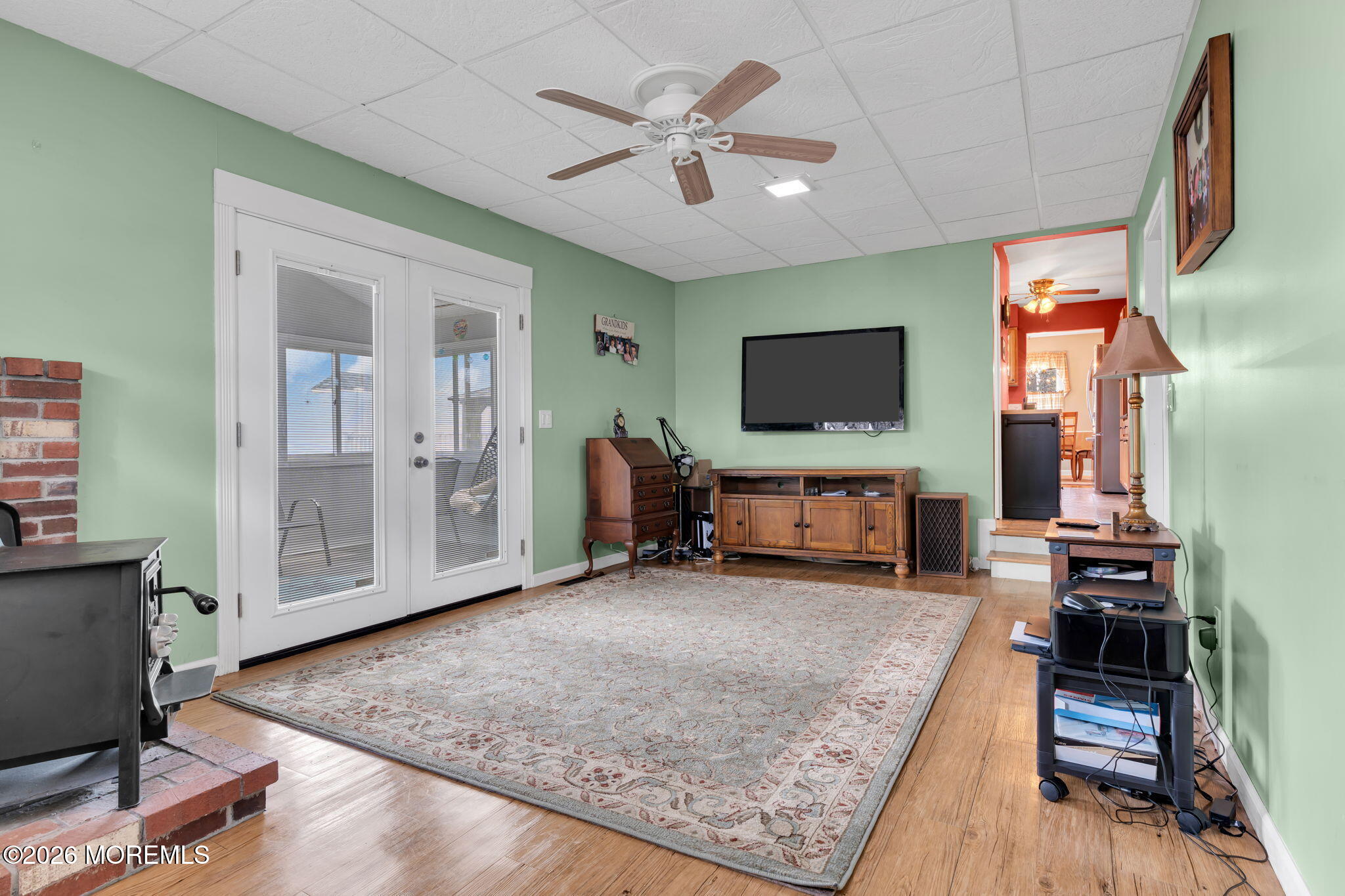 2908 Adams Street Wall, NJ 07719 - Photo 11 of 34 a living room with furniture and a flat screen tv