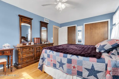 a bedroom with a bed and a dresser