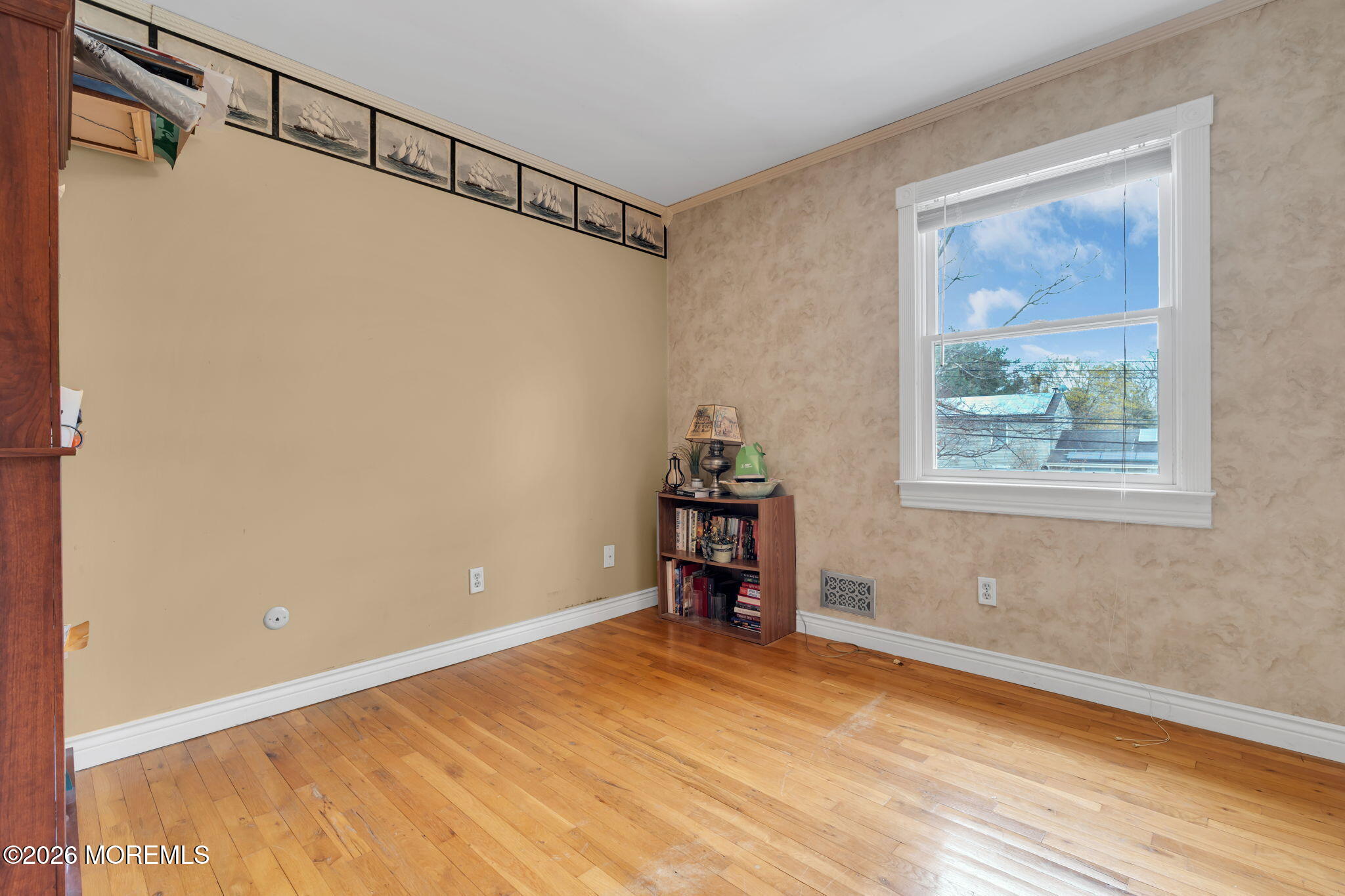 2908 Adams Street Wall, NJ 07719 - Photo 18 of 34 a view of a bedroom with wooden floor and windows