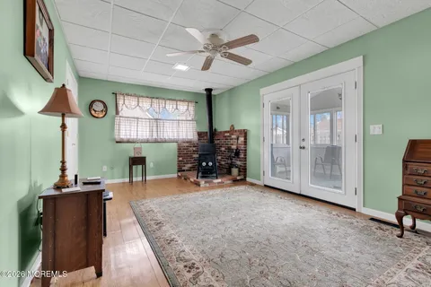 a view of a livingroom with furniture and a flat screen tv