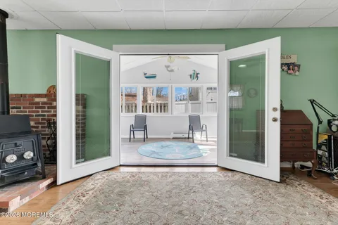 a view of a hallway with wooden shelves
