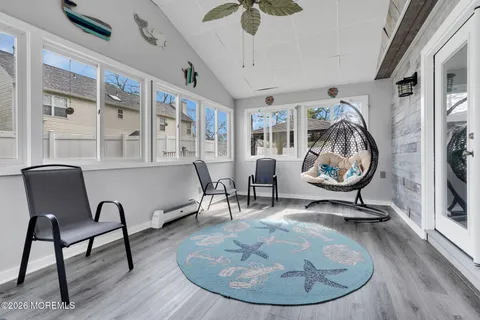 a view of a livingroom with furniture and a fireplace