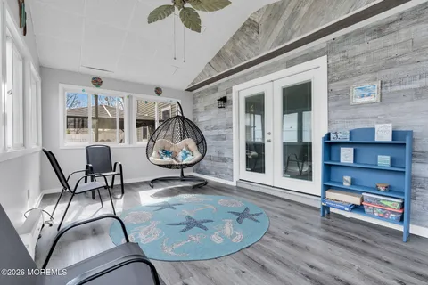 a view of a livingroom with furniture and a window