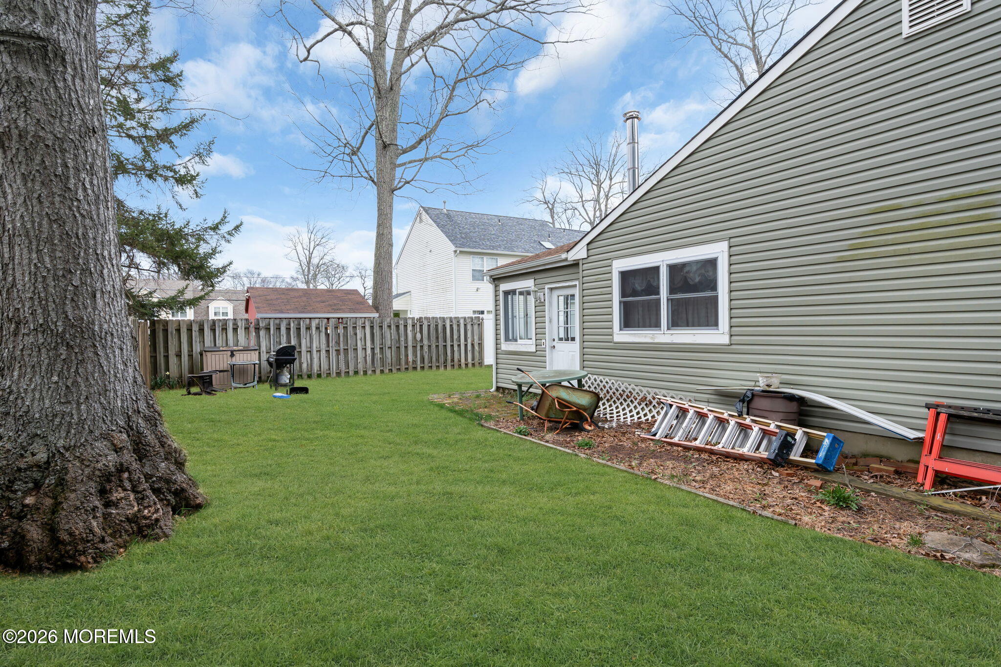 2908 Adams Street Wall, NJ 07719 - Photo 33 of 34 a view of a house with a yard and sitting area