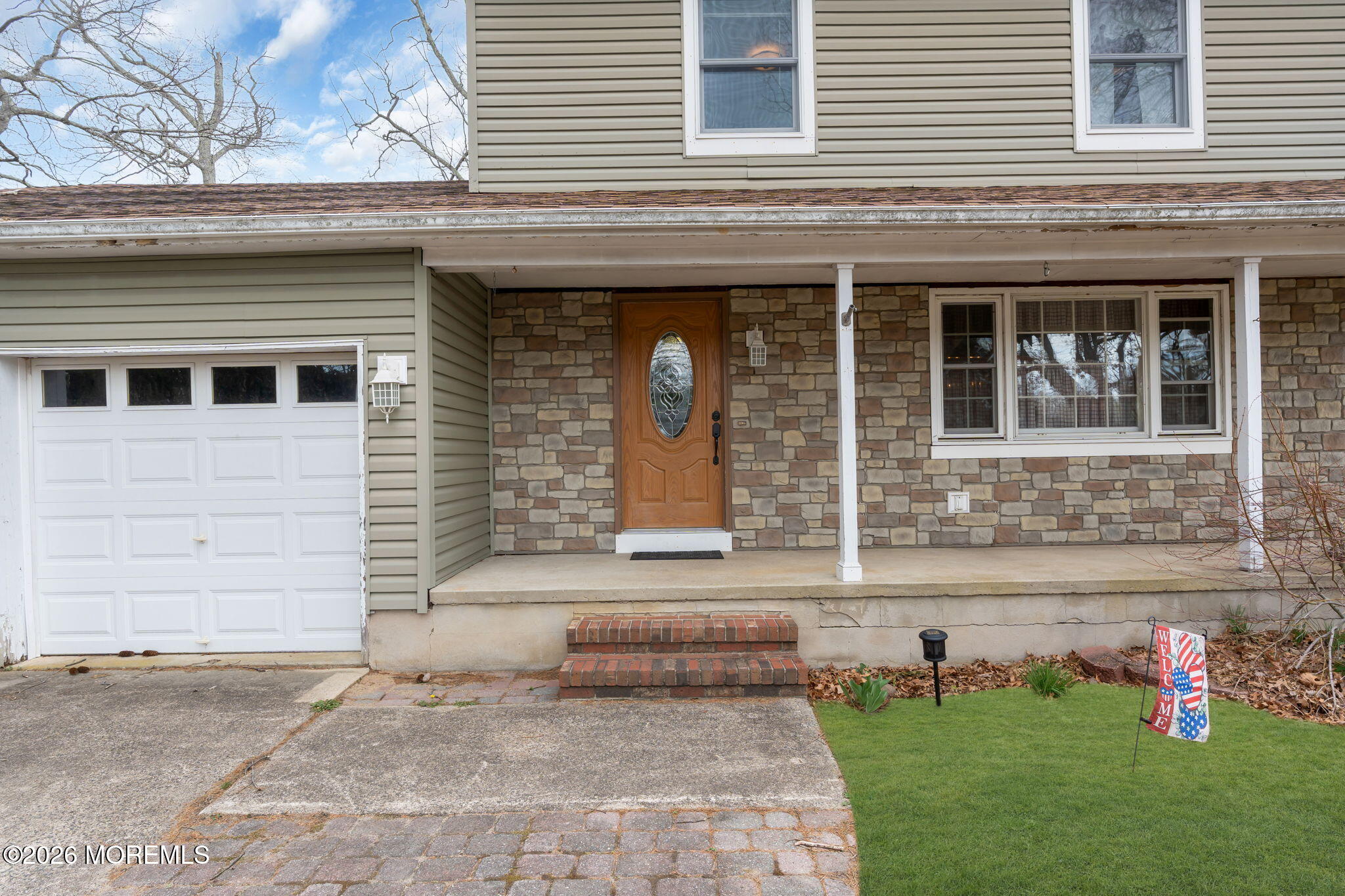 2908 Adams Street Wall, NJ 07719 - Photo 4 of 34 a front view of a house with a yard