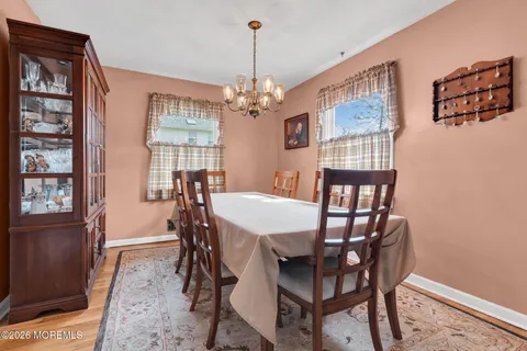 a view of a dining room with furniture and window