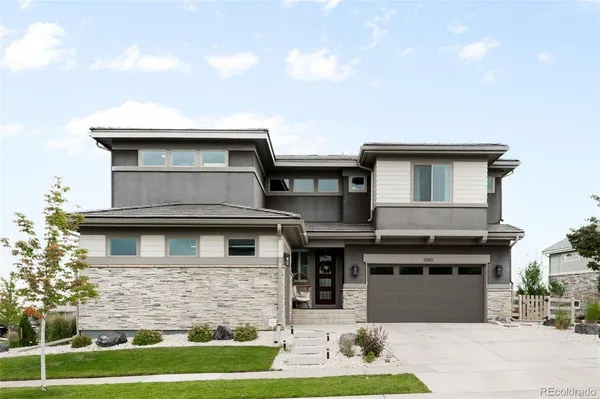 a front view of a house with yard