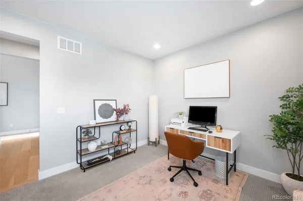 a view of a workspace with furniture