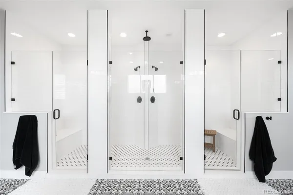 a bathroom with a tub and a shower