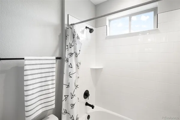 a bathroom with a shower and a shower