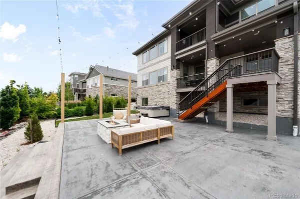 a view of residential house with outdoor space and seating area