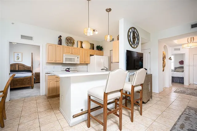 a view of kitchen with furniture and flat screen tv