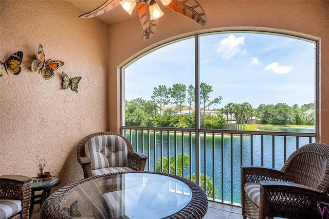 a view of a balcony with chair and table