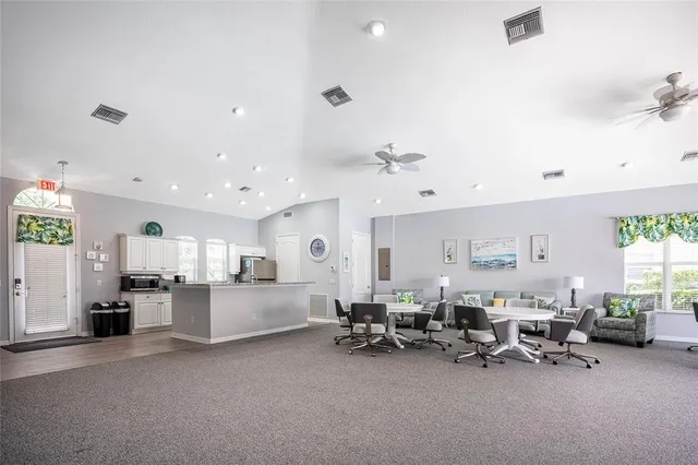 a large room with lots of furniture and windows