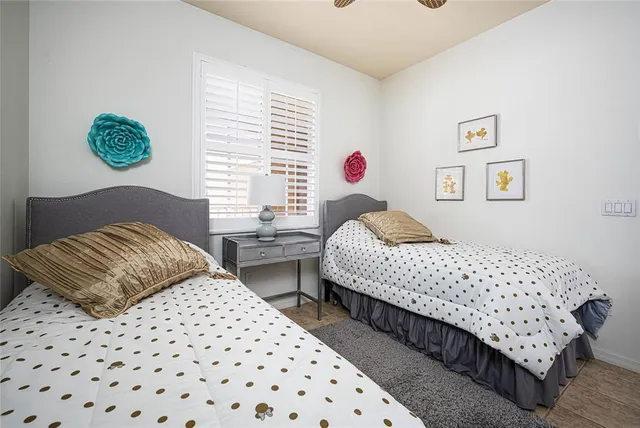 a bedroom with a bed and a couch