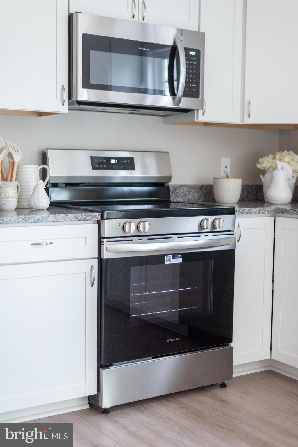 227 Forest Grove Road Colonial Beach, VA 22443 - Photo 11 of 22 a stove top oven sitting inside of a kitchen