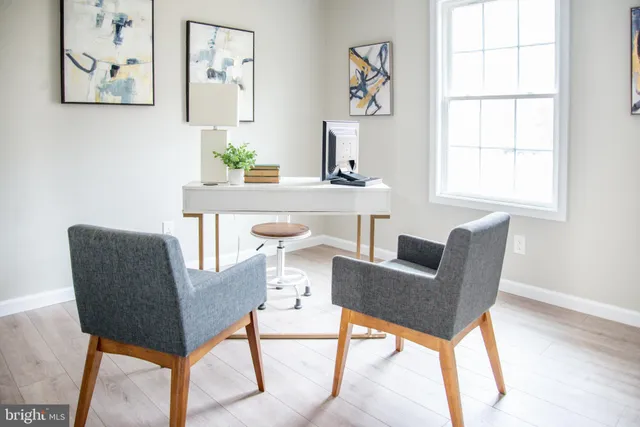 a bedroom with a bed and a chair