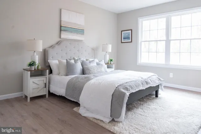a bathroom with a sink toilet and a mirror