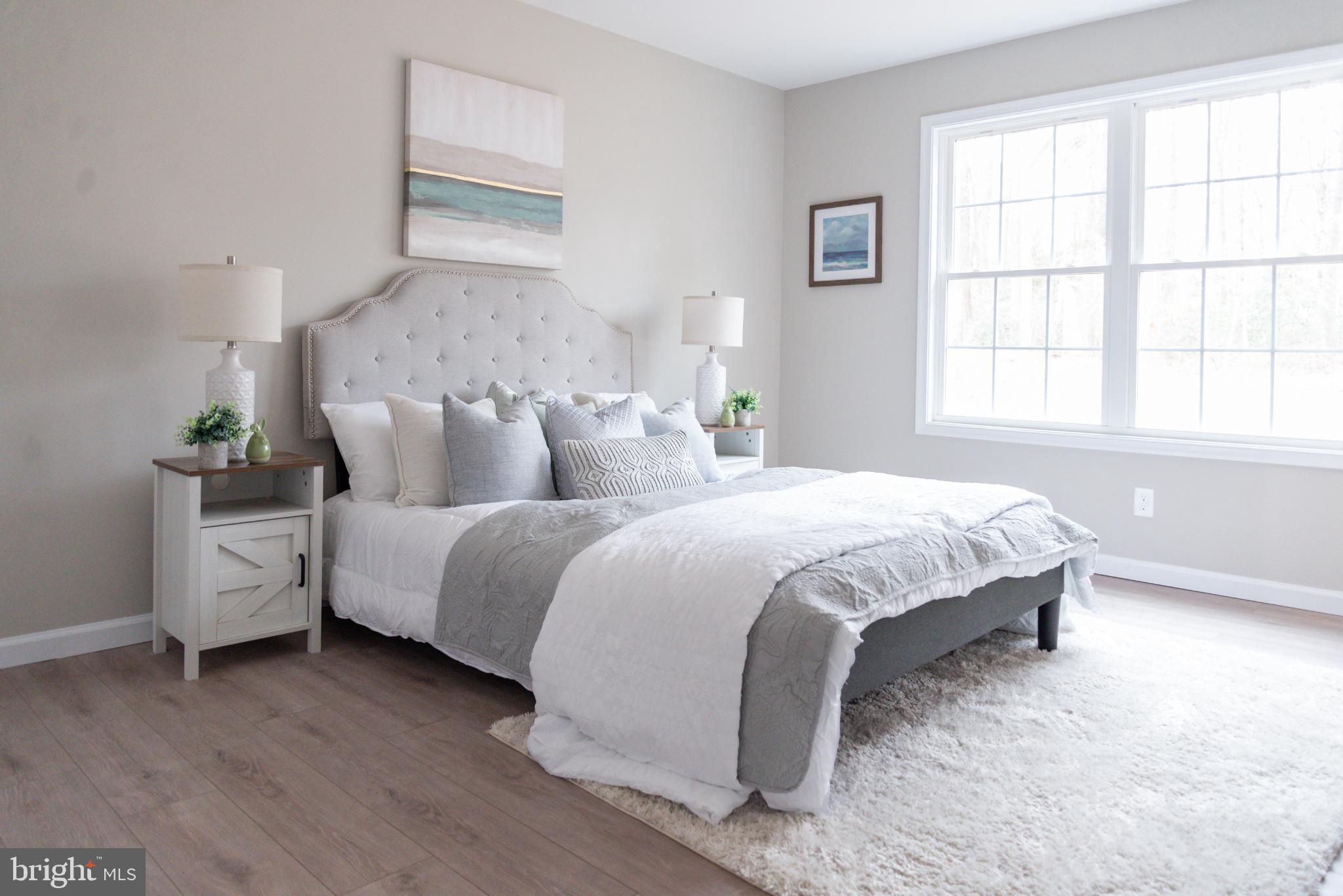 227 Forest Grove Road Colonial Beach, VA 22443 - Photo 17 of 22 a spacious bedroom with a bed and window