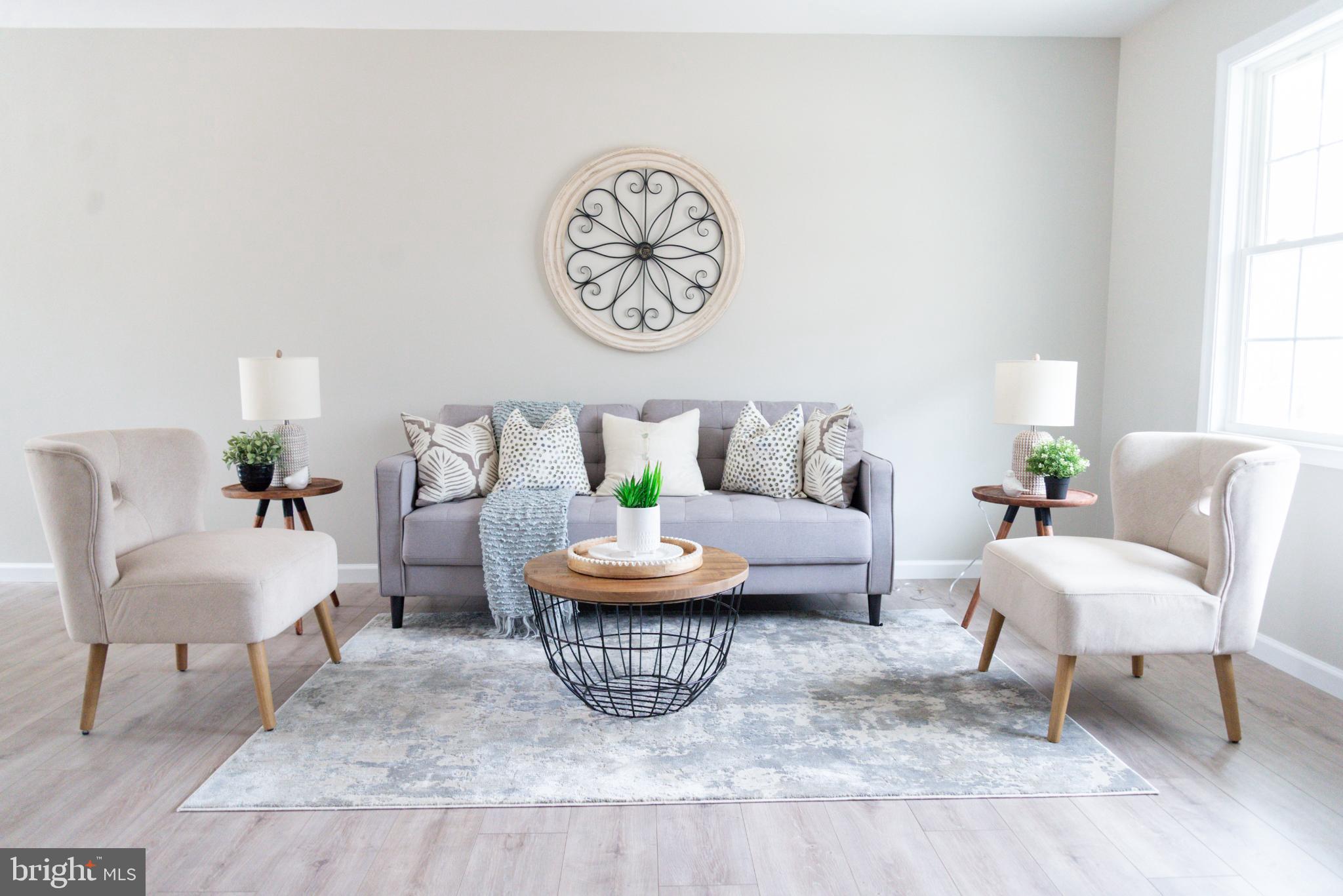 227 Forest Grove Road Colonial Beach, VA 22443 - Photo 3 of 22 a living room with furniture a rug and a window