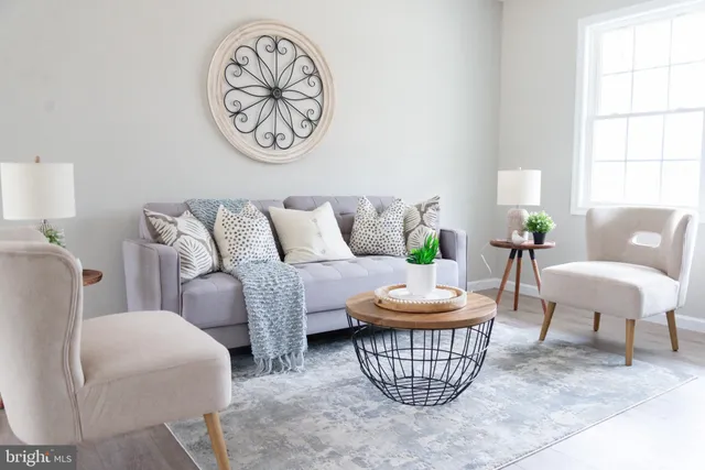 a living room with furniture and a window