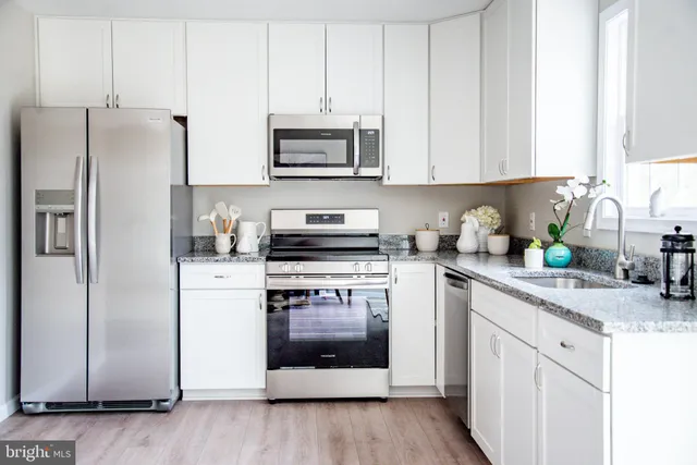 a view of kitchen with dining table and chairs
