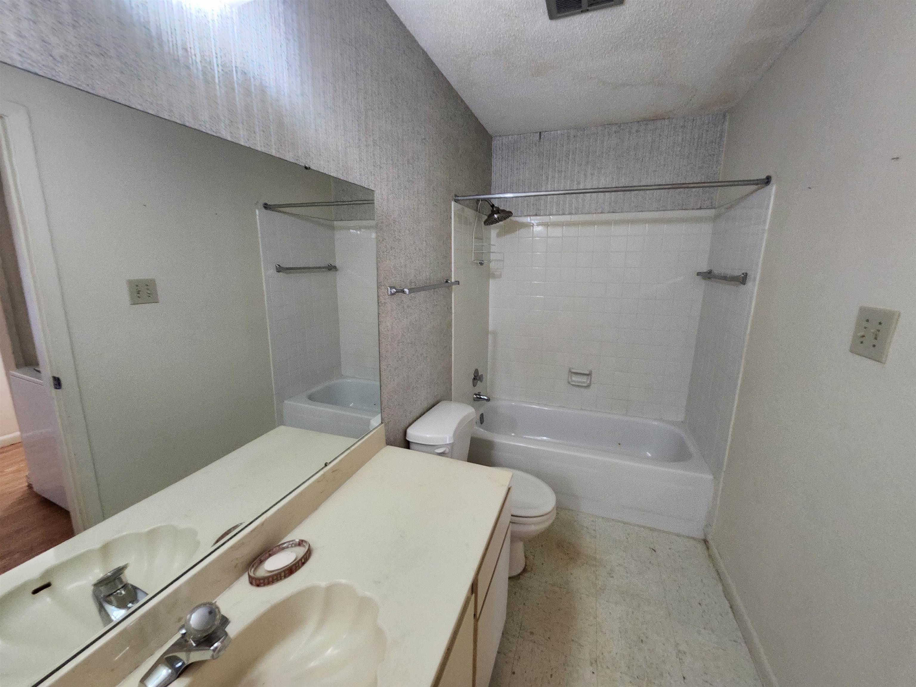 4776 Audubon View Circle, Unit 1 Memphis, TN 38117 - Photo 15 of 16 Full bathroom with shower combination, vanity, and a textured ceiling