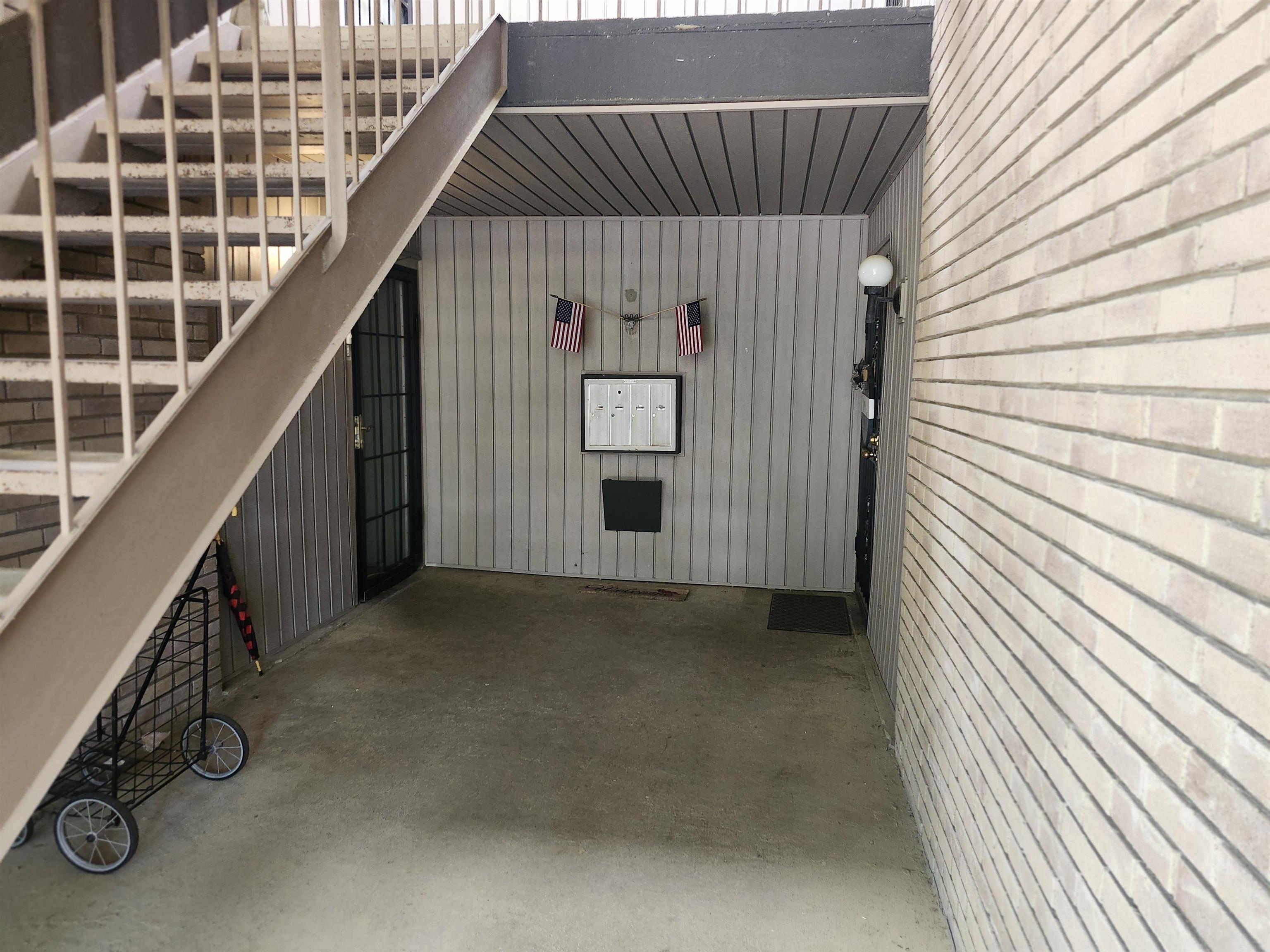 4776 Audubon View Circle, Unit 1 Memphis, TN 38117 - Photo 5 of 16 View of exterior entry with a patio