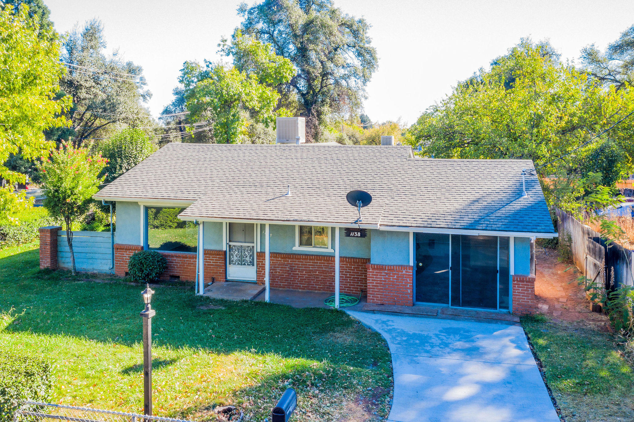 1138 Layton Road Redding, CA 96002 - Photo 1 of 22 a view of a house with a garden and plants