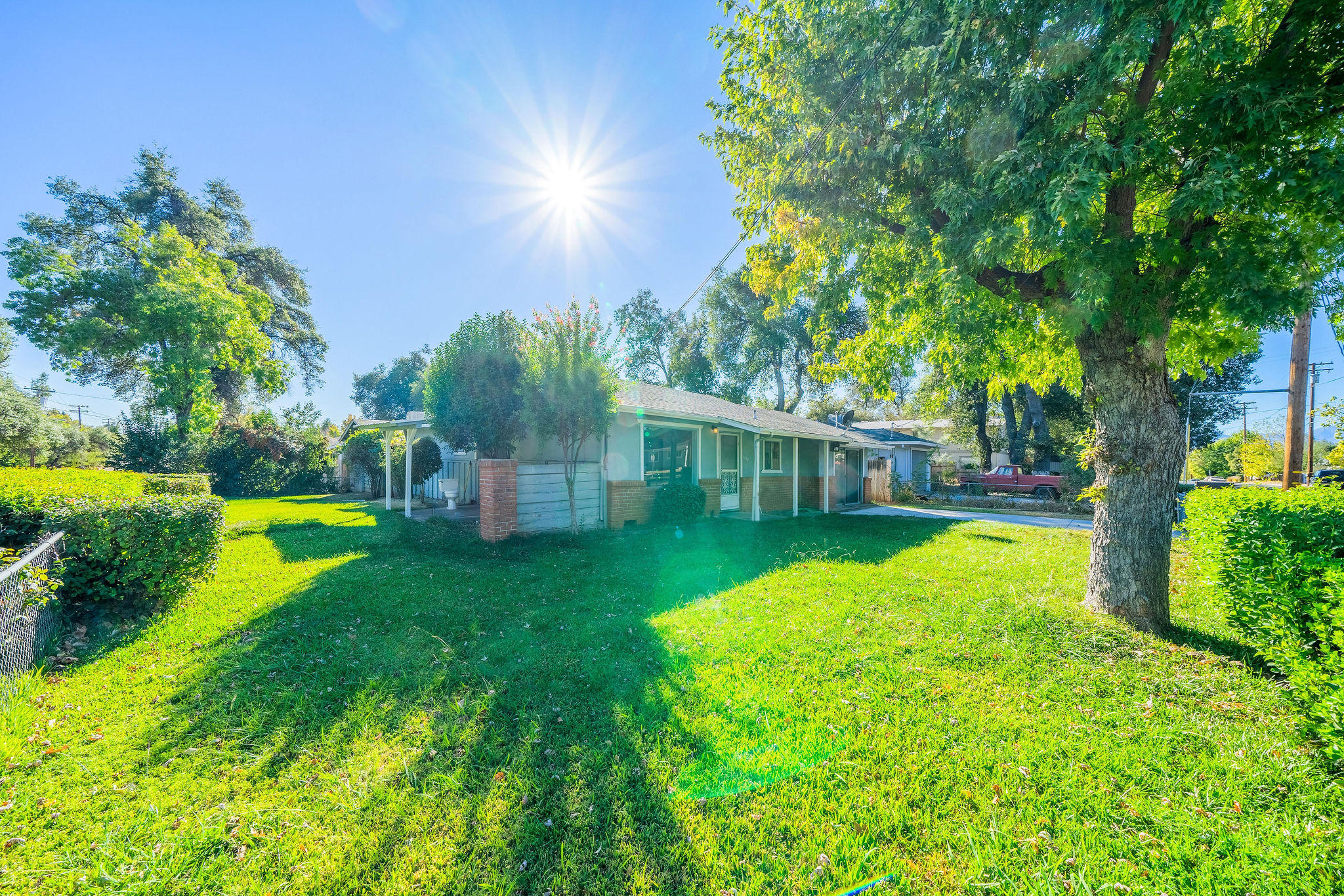 1138 Layton Road Redding, CA 96002 - Photo 17 of 22 a view of a house with swimming pool and a yard