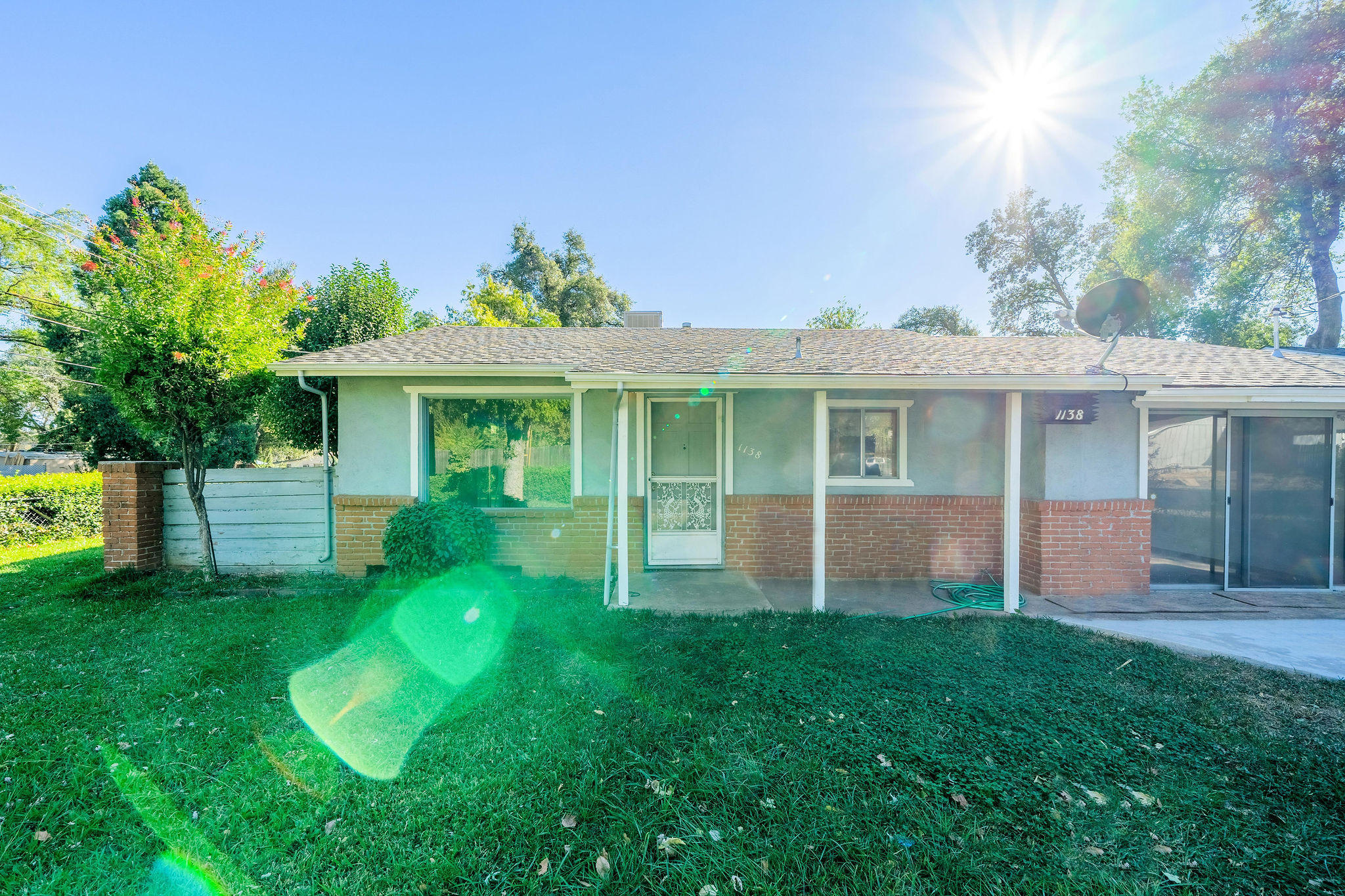 1138 Layton Road Redding, CA 96002 - Photo 3 of 22 a view of a house with a yard and sitting area
