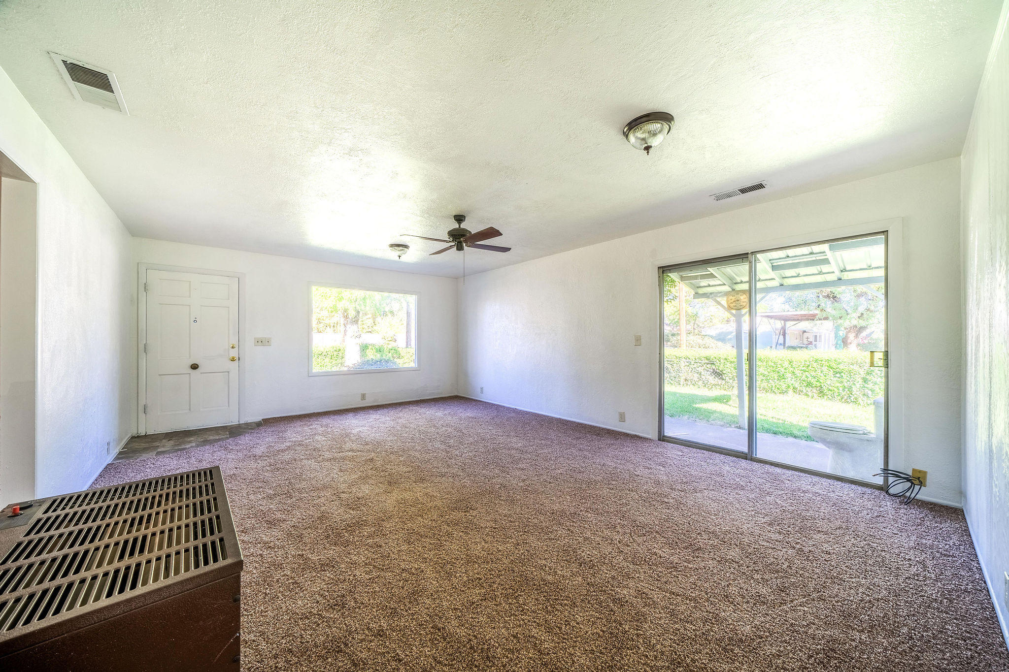 1138 Layton Road Redding, CA 96002 - Photo 5 of 22 a view of an empty room with a window