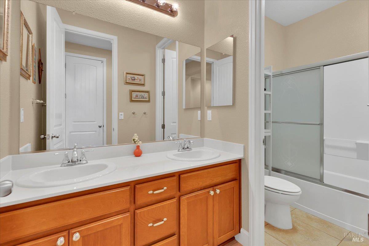 331 Frisbie Circle Vacaville, CA 95688 - Photo 30 of 93 Full guest bath with double sinks and a private shower and commode area which is ideal when many people need to get ready at the same time!