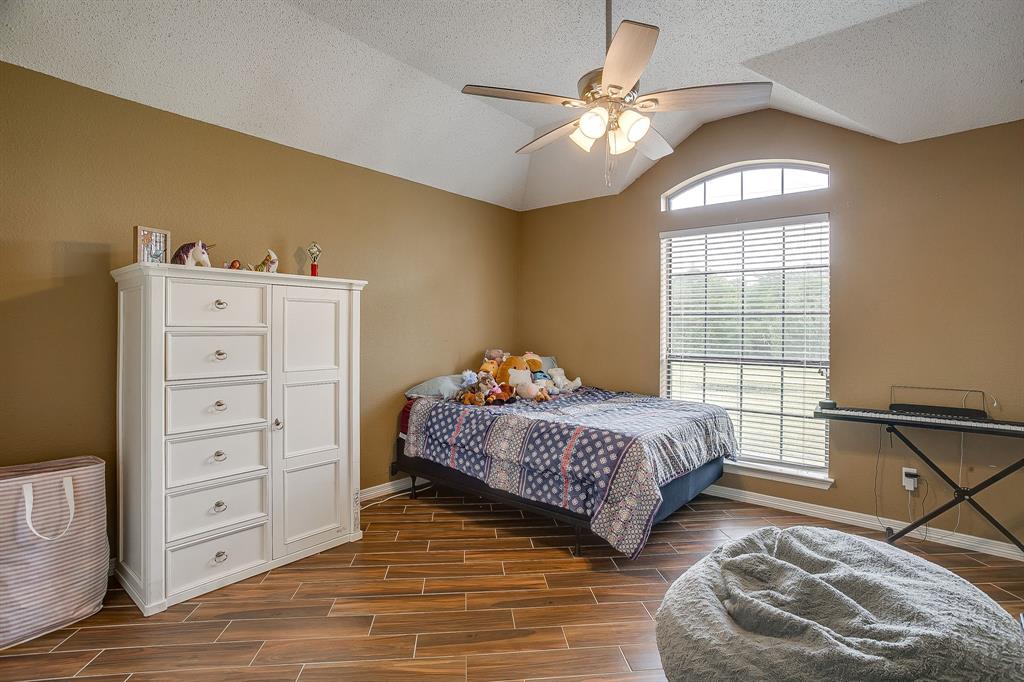 1050 Hampel Road Palmer, TX 75152 - Photo 30 of 35 a bedroom with a bed and a window