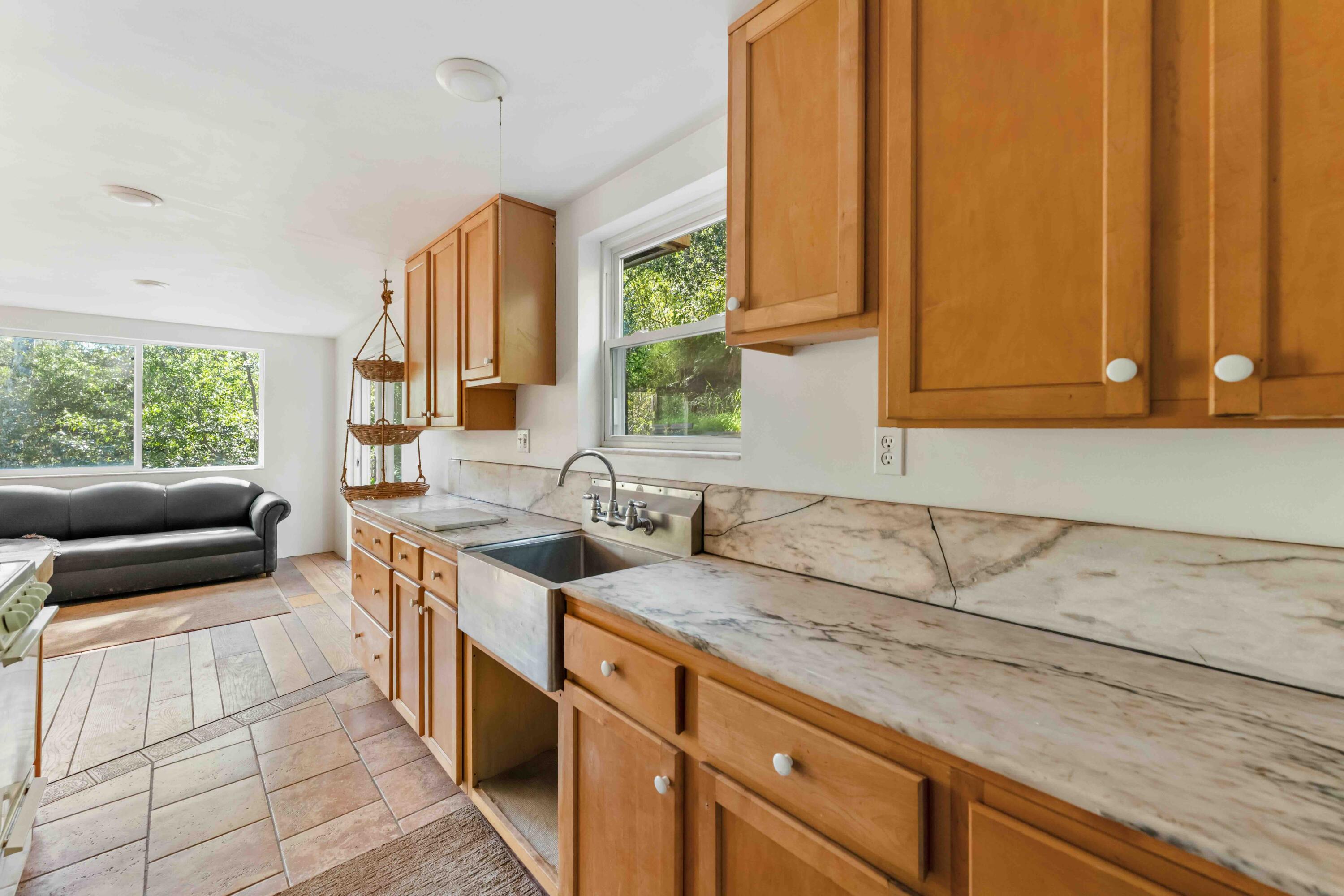2011 North San Marcos Road Santa Barbara, CA 93105 - Photo 21 of 41 a kitchen with stainless steel appliances granite countertop a sink a stove and a microwave