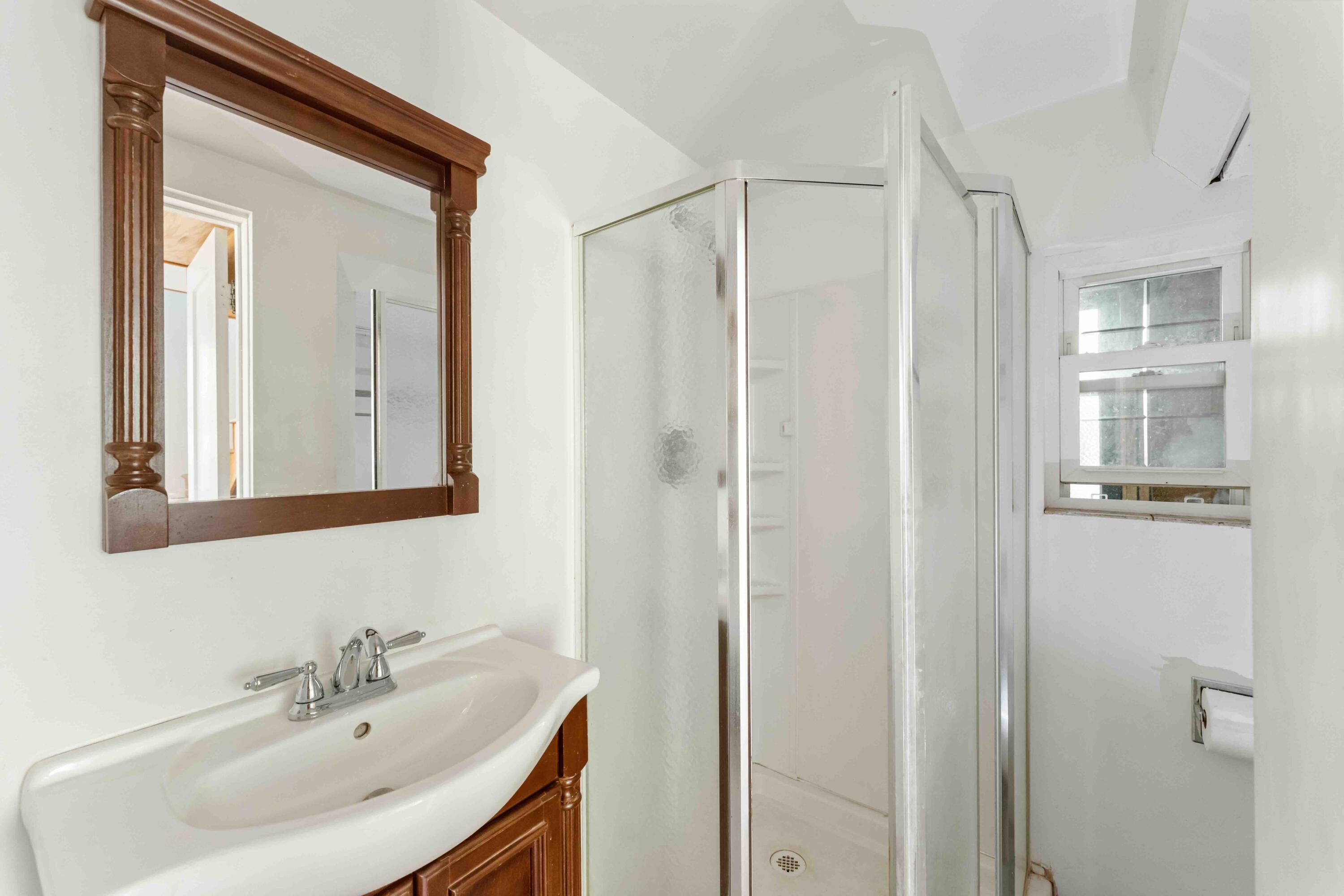 2011 North San Marcos Road Santa Barbara, CA 93105 - Photo 23 of 41 a bathroom with a sink a mirror and a shower