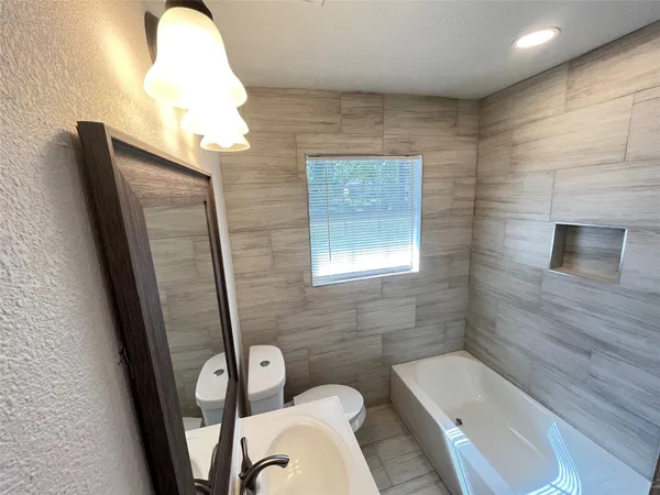 a bathroom with a toilet and a sink
