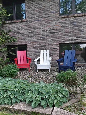 a bedroom with a bed and a chair