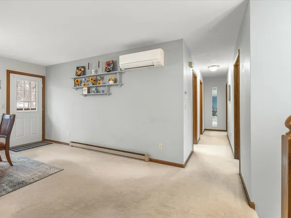 a bedroom with a bed and a rug