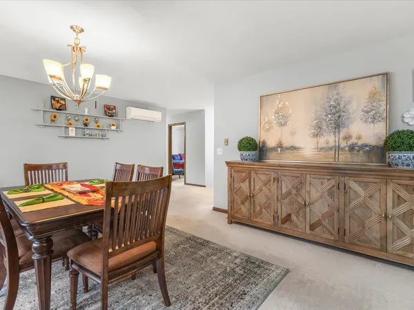 a view of a dining room with furniture and window