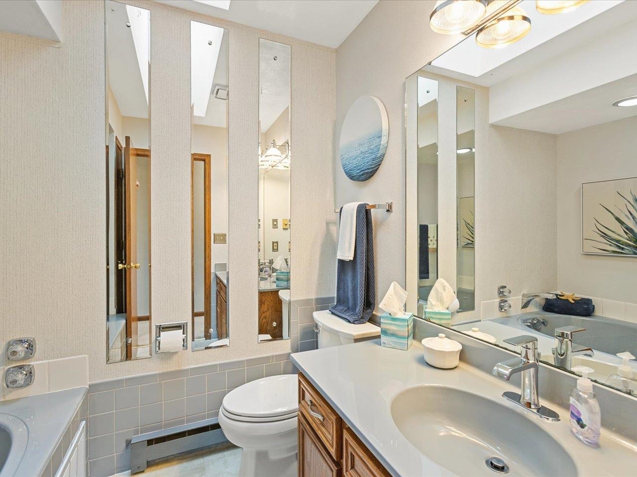 548 Baintree Road Lake Summerset, IL 61019 - Photo 33 of 71 a bathroom with a sink a toilet and a mirror