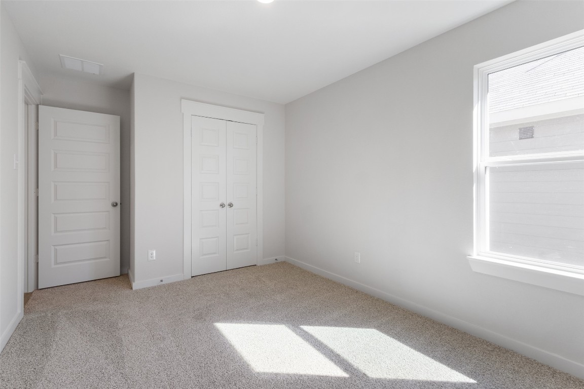 11811 Stratosphere Street Conroe, TX 77303 - Photo 11 of 13 an empty room with windows