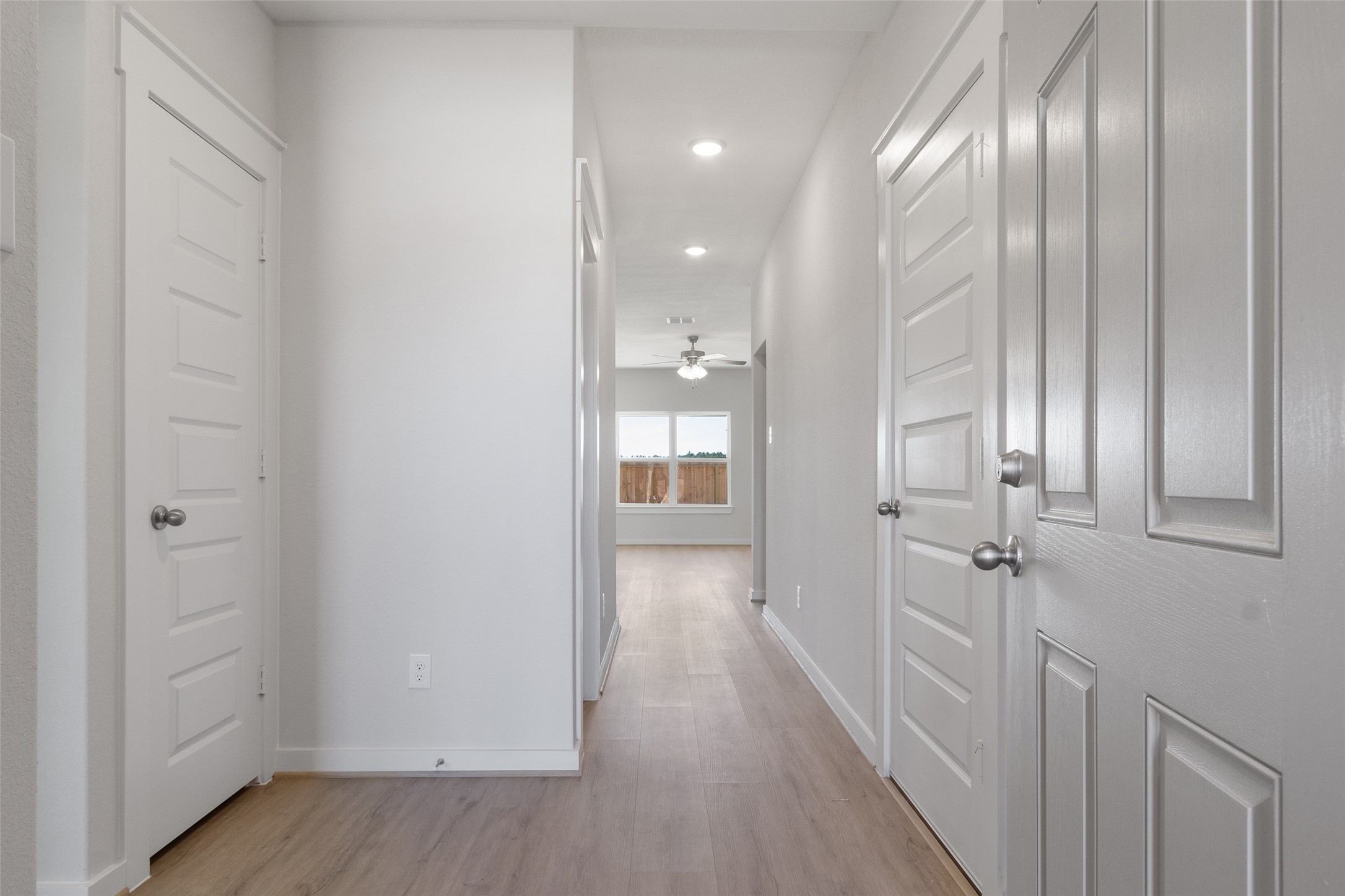 11811 Stratosphere Street Conroe, TX 77303 - Photo 3 of 13 a view of a hallway with wooden floor
