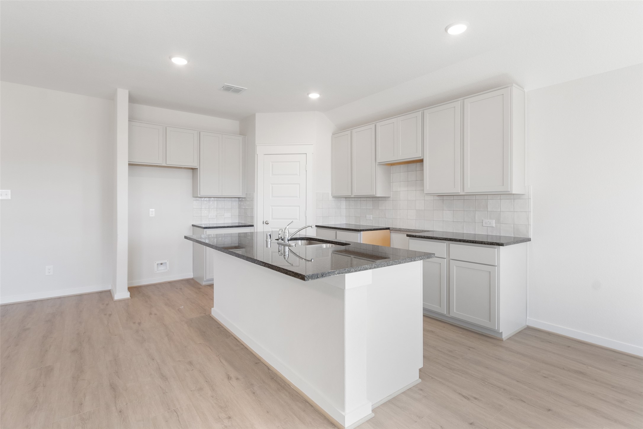 11811 Stratosphere Street Conroe, TX 77303 - Photo 4 of 13 a kitchen with stainless steel appliances granite countertop a sink and a stove