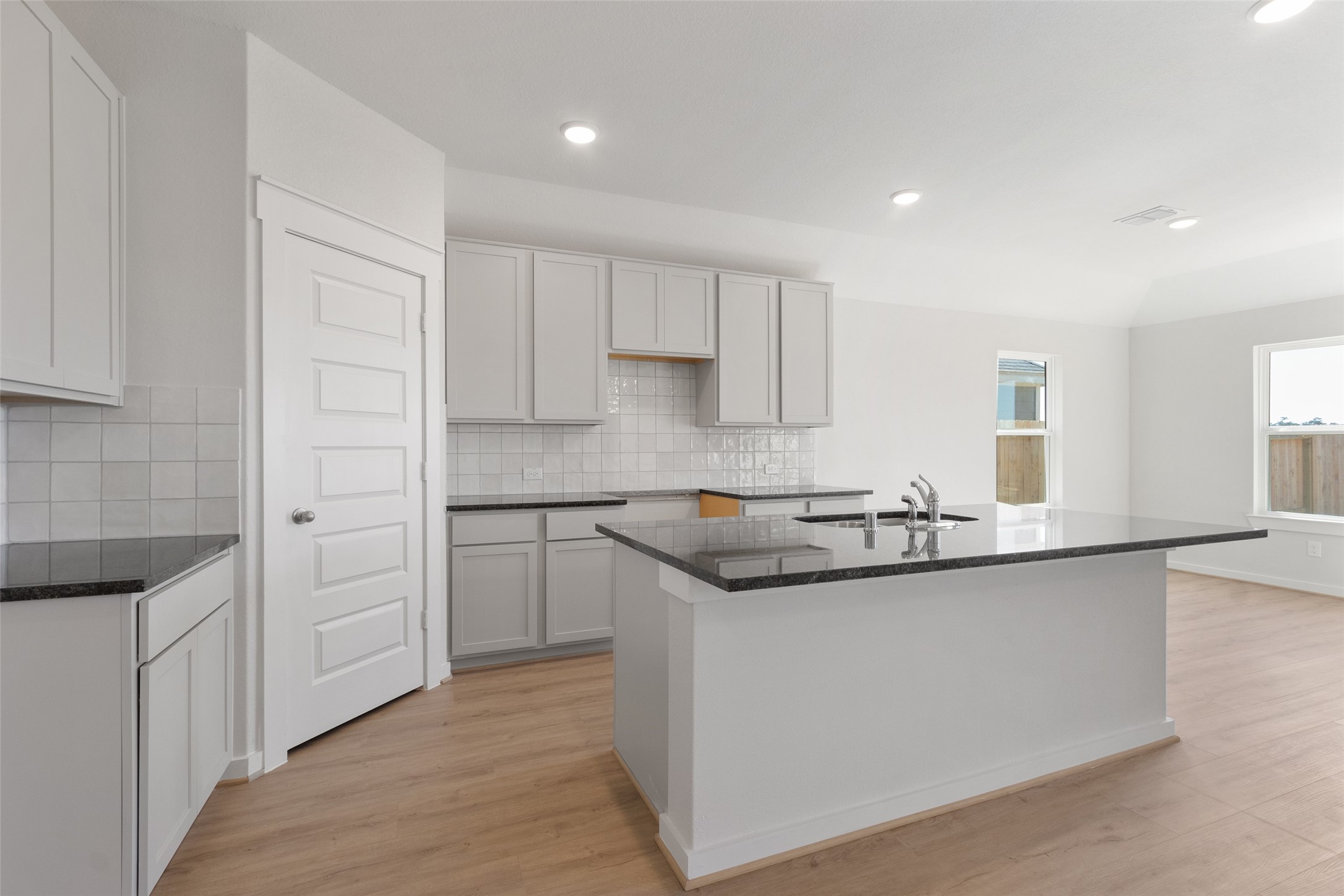 11811 Stratosphere Street Conroe, TX 77303 - Photo 5 of 13 a kitchen with stainless steel appliances granite countertop a sink and cabinets