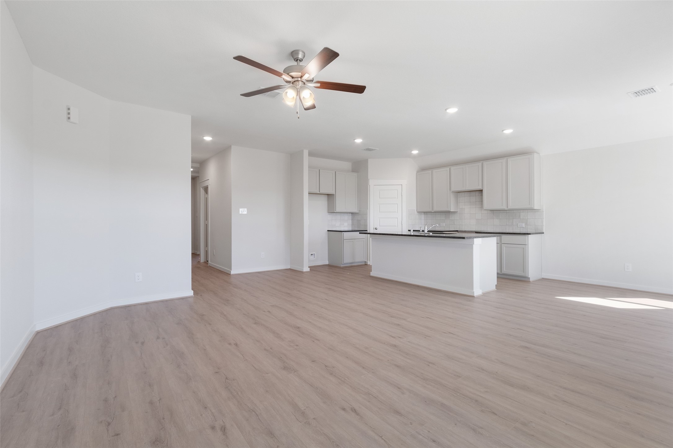 11811 Stratosphere Street Conroe, TX 77303 - Photo 6 of 13 a view of kitchen with wooden floor and window