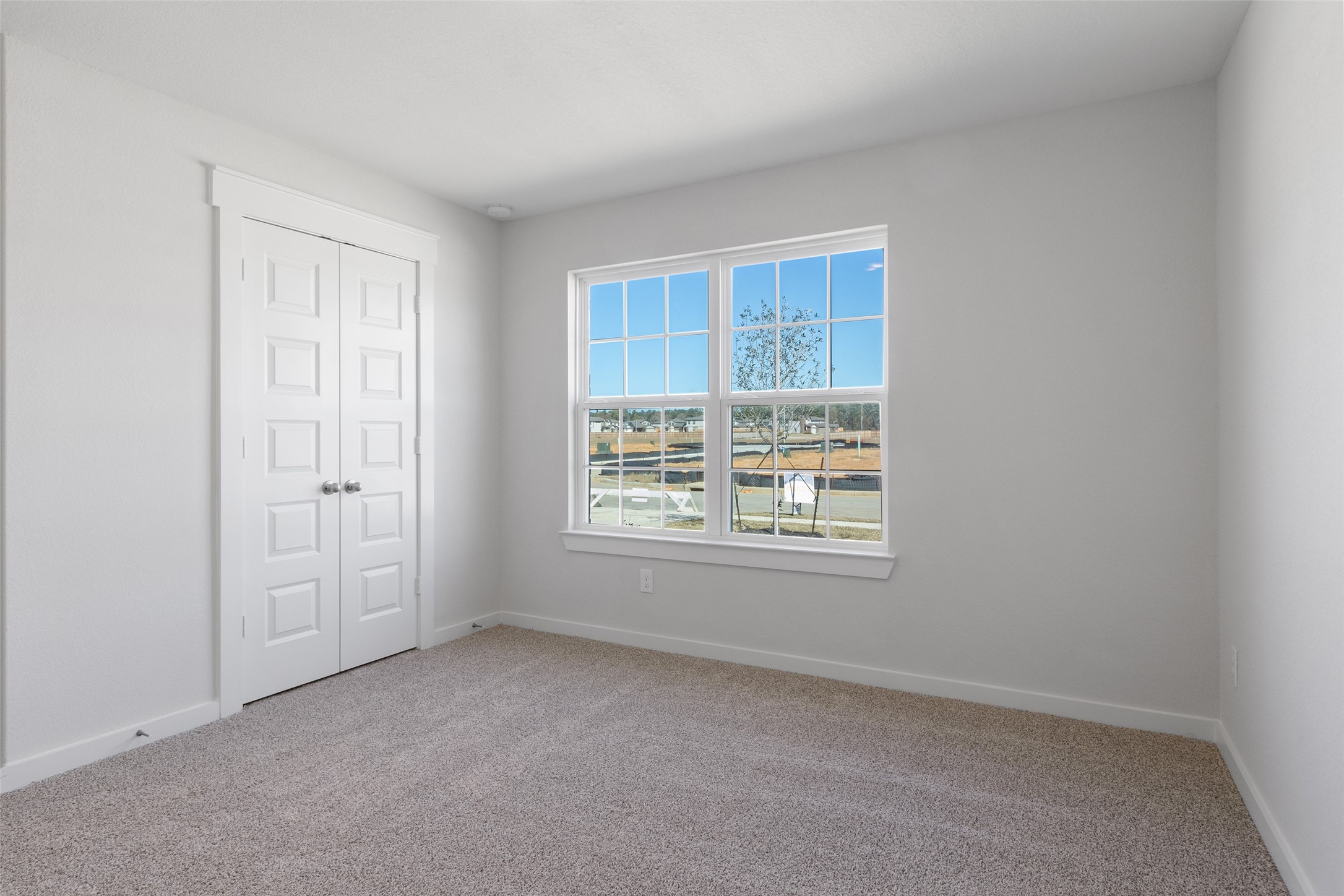 11811 Stratosphere Street Conroe, TX 77303 - Photo 10 of 13 an empty room with windows